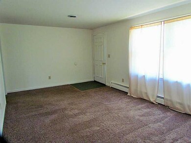 Living Room. Big windows let the sunshine in. Load