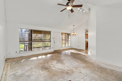 Living with view towards back of the home and kitc