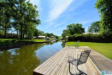 Lake side deck for sunning and dock for boat