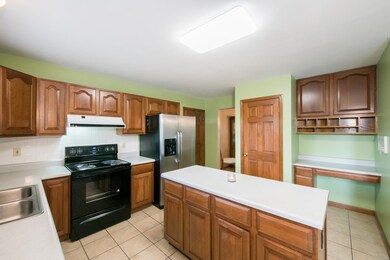 Spacious kitchen has lots of cabinet space, includ
