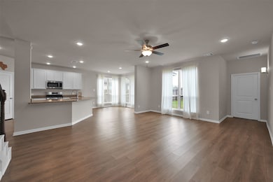View of the kitchen and living area from the half