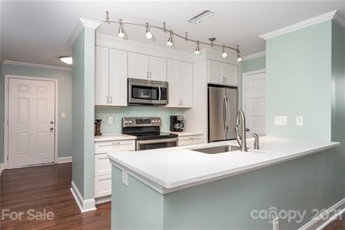 KITCHEN UPDATED UPDATED, CABINETS, STAINLESS APPLIANCES, ADDED CABINET AROUND REFRIGERATOR, QUARTZ COUNTERTOPS, UPDATED STAINLESS SINK AND FAUCETS, UPDATED LIGHT FIXTURE.CONVECTION STOVE, TILE BACKSPLASH, PANTRY CLOSET, UPDATED FLOORING.