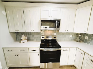 Quartz Counter Tops, High End Stainless Steel Appliances, Ceramic Tile Backsplash