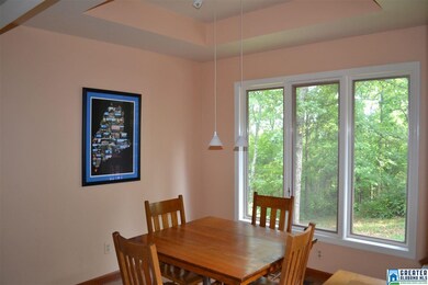 Beautiful windows and a tray ceiling make this din