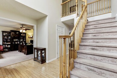 Stairway With View of Living Room/Office