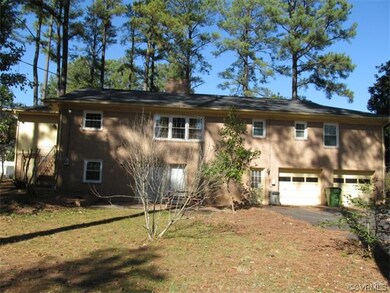 Rear view showing double car garage and all brick 