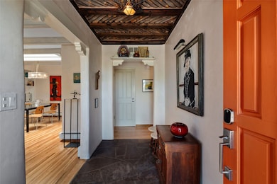 Front flagstone entrance, transition to original oak hardwood, notice the ceiling detail, Santa Fe latillas