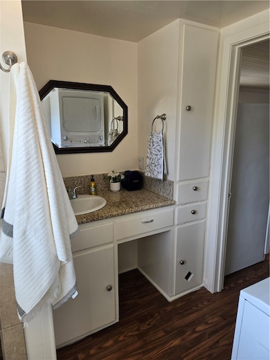 Bathroom featuring wood finished floors, vanity, a