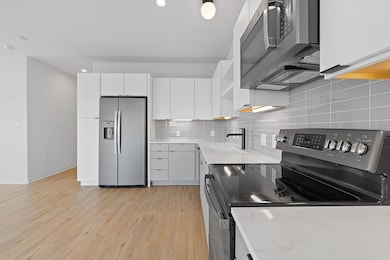 Kitchen featuring appliances with stainless steel