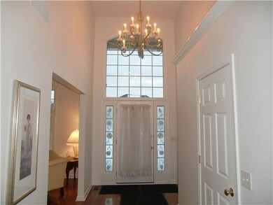 Foyer. Hardwood entry with colored glass 