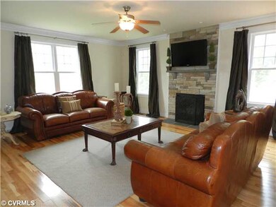 Den/Family/Great Room - This is the family room with stone fireplace and  surround sound.  Also home has a security system.