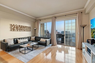 Living room featuring a view of city, ornamental m