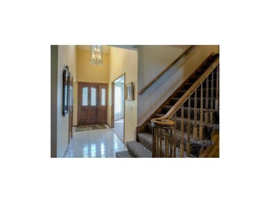 Two story entry with tile floor greets you as you 