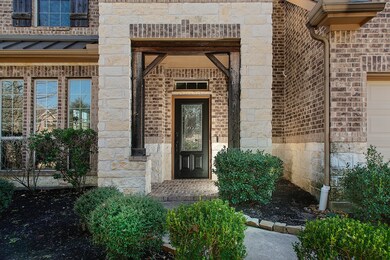Brick and stone elevation with wood accent beams a