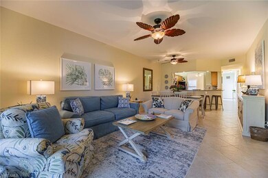 Tiled living room featuring ceiling fan