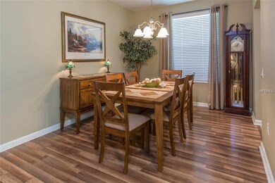 The dining room has the same beautiful laminate fl