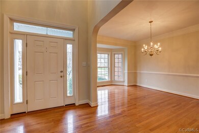 Foyer - Two-story entry, Palladian window above door (not shown here) hardwood floors, front door with sidelights and transom.
