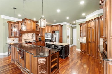 Kitchen with a sink, appliances with stainless ste