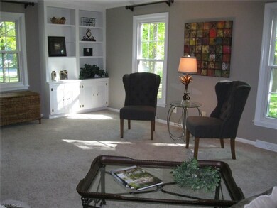 Living room boasts lots of windows.