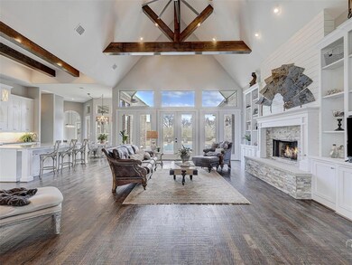 Open living/kitchen area with stunning exposed cei