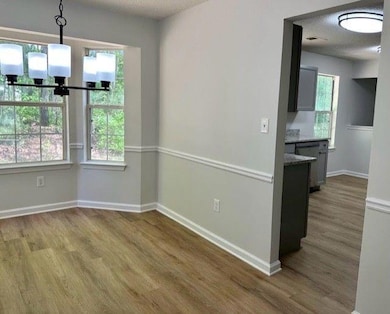 dining room opens to kitchen and liviing room