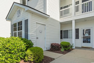 Property entrance featuring a balcony