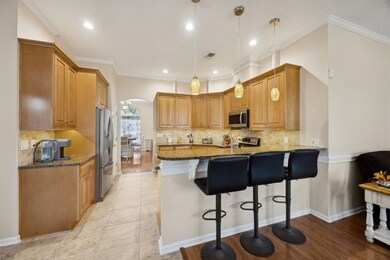 Spacious kitchen with bar seating.