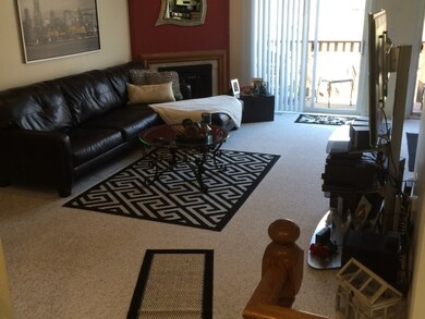 Spacious living room includes fireplace