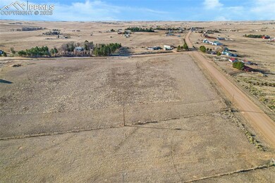 Birds eye view of property with a rural view