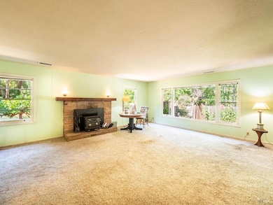 Wide windows bring in wonderful light and overlook the beautiful flower beds.