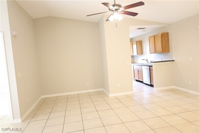 Unfurnished room featuring lofted ceiling, a ceili