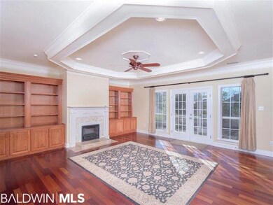 Spacious room with hardwood floors, beautiful fire