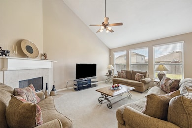 THE SOARING CEILING MAKES THIS ALREADY SPACIOUS DEN EVEN LARGER WITH A COZY FIREPLACE READY FOR THE UPCOMING HOLIDAYS