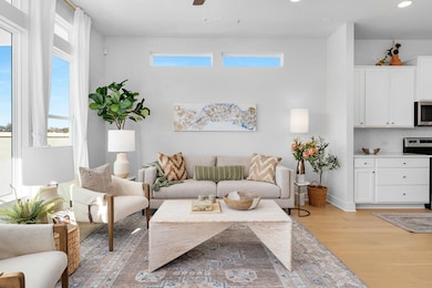 Living room with recessed lighting, a ceiling fan