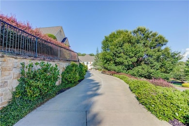 View of home's community with fence