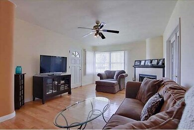 Living room with gas-fed fireplace, large mantle, 