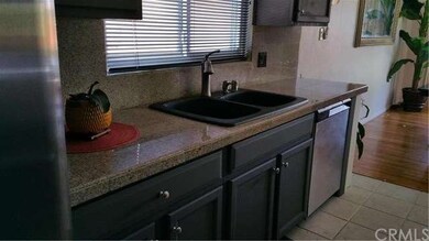 Sunny kitchen window over the kitchen sink.