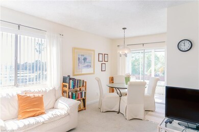 Carpeted dining space with a textured ceiling
