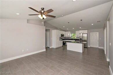 Kitchen featuring visible vents, white cabinets, o