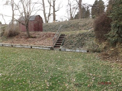Tiered Rear yard with 12 x10 Amish shed with loft.