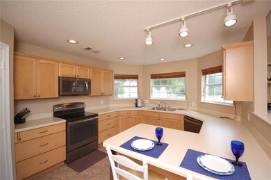 Loads of counter space, bay windows provide lots o