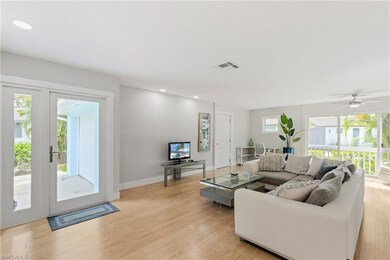 Living room featuring light wood-type flooring, ce