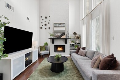 This spacious living room features high ceilings,