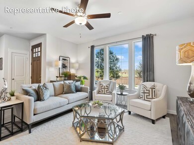 Living room featuring ceiling fan and light wood-type flooring