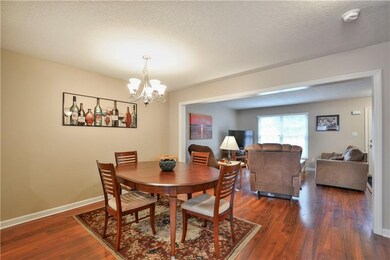 Dining Room with Laminate Flooring Open to Eat in 