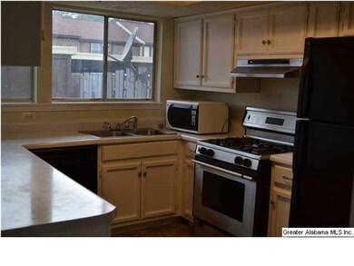 KITCHEN WITH WINDOW LOOKING OUT TO PATIO AREA