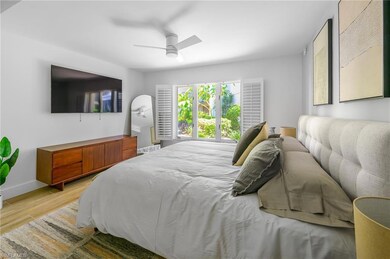 Bedroom with a ceiling fan, baseboards, and light 