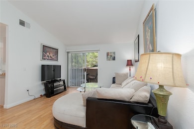 Living area featuring light wood finished floors a