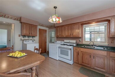 Laminate hardwoods and faux wooden white blinds ar