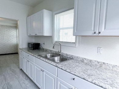 Front Unit: Plenty of cabinets in this kitchen